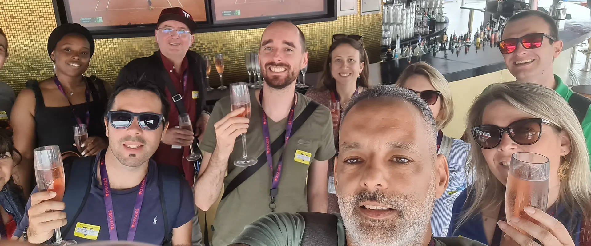 Cruisers sharing a toast at a ship bar
